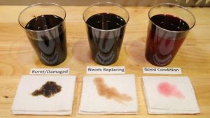 different stages of used steering fluid.